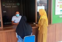 Potrer Pelayanan Kesehatan di Puskesmas Dabo Lama (Foto : Zonamu/Ari)