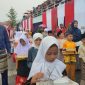 Peserta Pawai Pembangunan di Dabo Singkep Tetap Antusiaa Meski Hujan | Foto : Zonamu/Imam