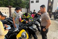 Polres Indragiri Hilir berhasil mengamankan 14 motor dalam penertiban balap liar di Jalan Telaga Biru Parit 8. Tindakan tegas ini diambil demi kenyamanan warga dan keselamatan pengguna jalan. | Foto: Zonamu/Humas Polres Inhil
