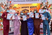 Manajemen PT BPR Tuah Karimun mengimbau masyarakat dan pengunjung kegiatan Enjoy Karimun untuk tetap mengenakan masker dan menjaga kesehatan di tengah kondisi udara berkabut asap | Foto: Zonamu/Humas BPR Tuah Karimun